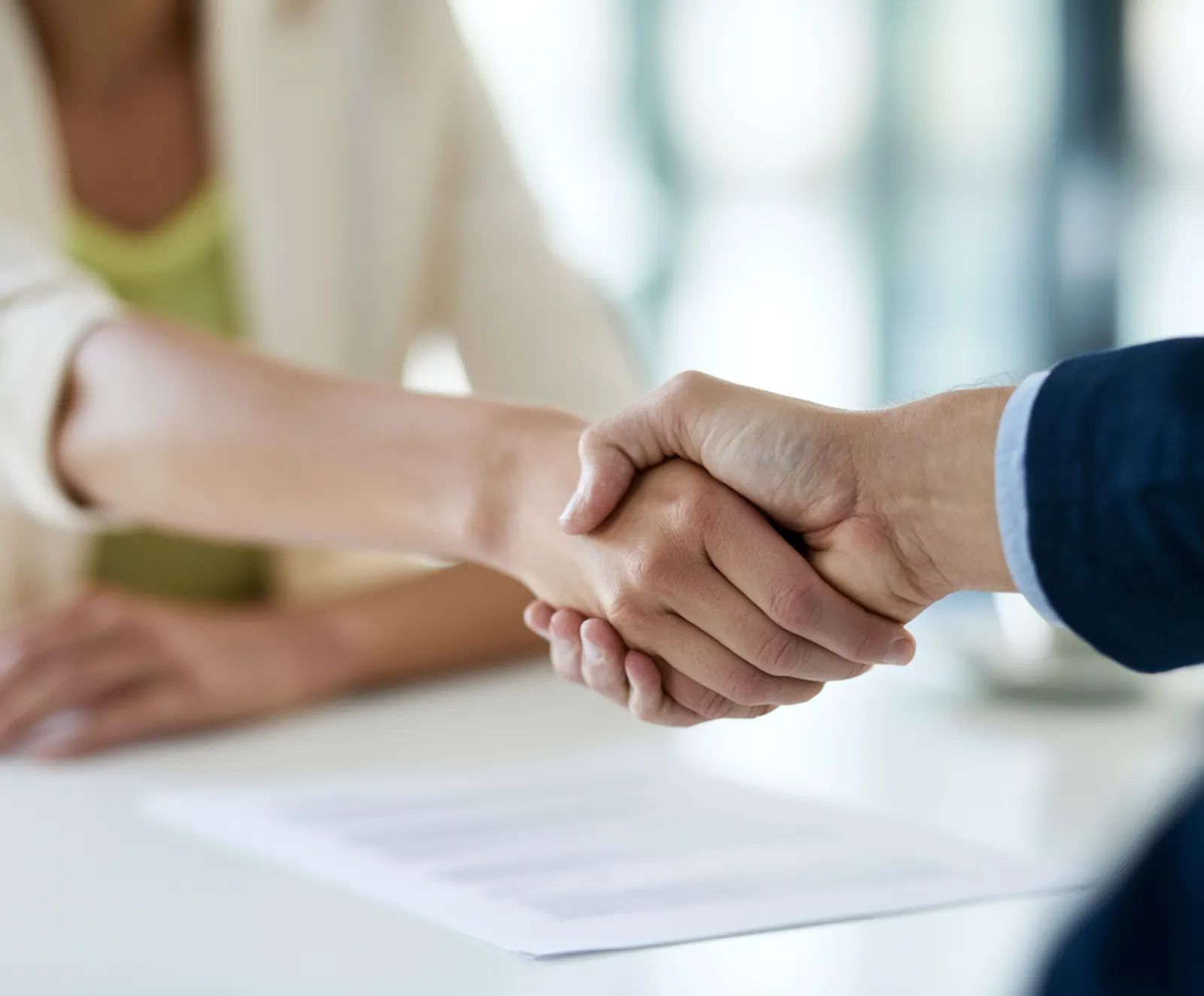 Handshake over the signed employment contract — household help Switzerland